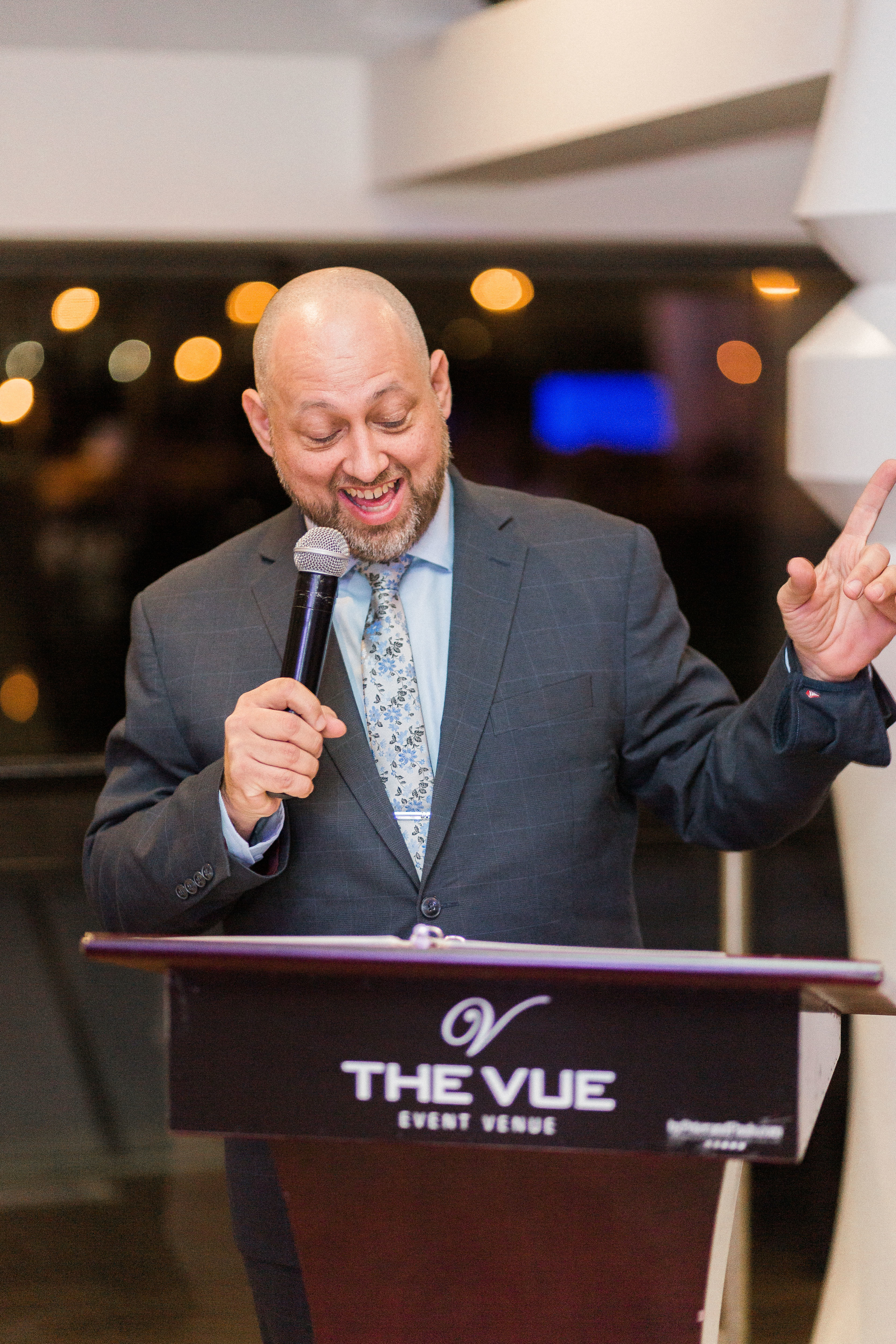 DJ Joe Seyler hosting a wedding reception from the podium